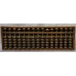 An early 20th century Chinese padouk wood abacus 33cm wide