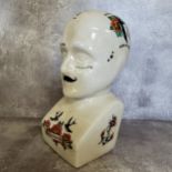 A large modern crackle glazed 'phrenology' bust with Ed Hardy style tattoo decoration