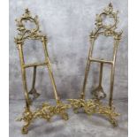 A pair of substantial ornate gilt metal table easels / stands 52cm high