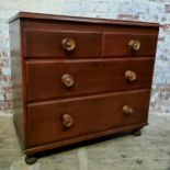 A small early Victorian mahogany chest of two short over two long graduated drawers, bold