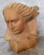 Garden Statutory- a 20th century terracotta sculpture of a woman with wind flowing through her hair,