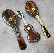 Three Victorian tortoise shell and mother of pearl miniature instrument models, two mandolins and