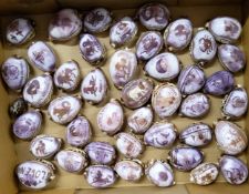 A collection of fourty four carved cowrie shell souvenirs