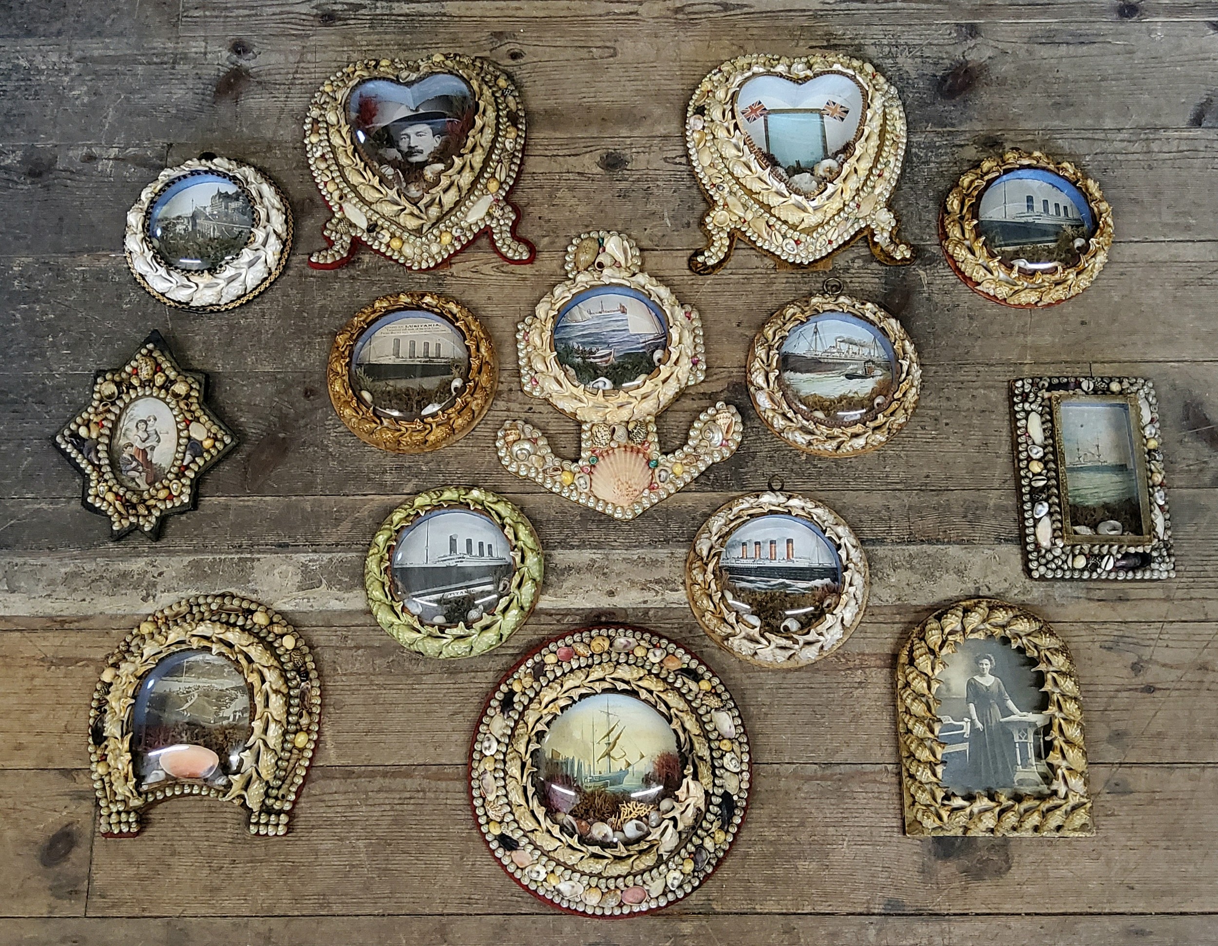 A very good collection of Fourteen Victorian shell-work souvenir porthole pictures, late 19th/