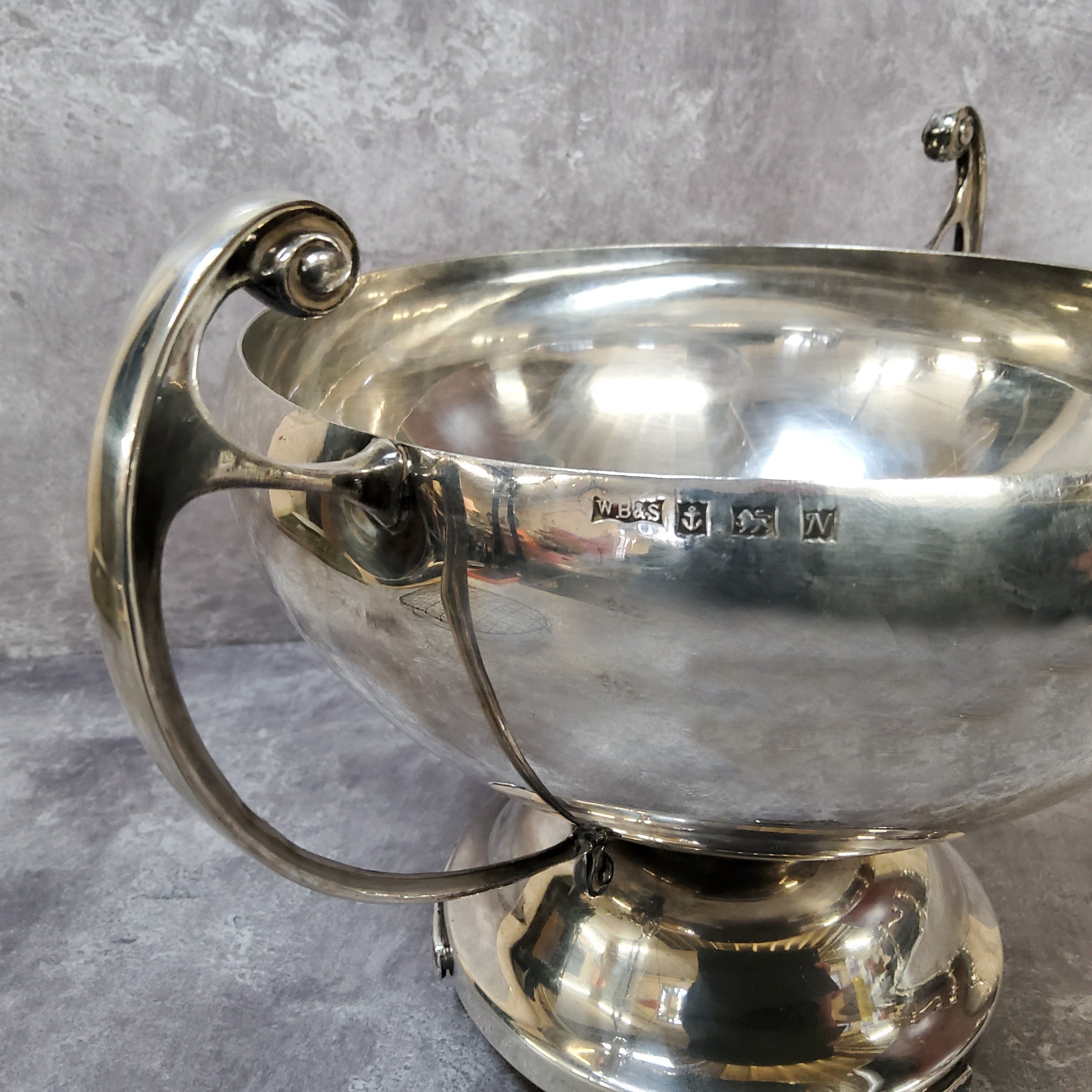 A silver two handled circular rose bowl, scroll handles, spreading circular foot, raised on three - Image 2 of 3