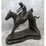 Horse Racing Interest - A well executed bronze horse and jockey clearing a fence, veined belge