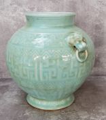 Oriental Ceramics - A Kangxi period or later Chinese pale celadon glazed vase, carved in low
