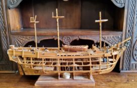 A large scratch built galleon cut-away, complete to one side, disected to the other showing