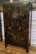 An 18th century style Chinese black lacquered marriage chest, decorated with pseudo-Oriental