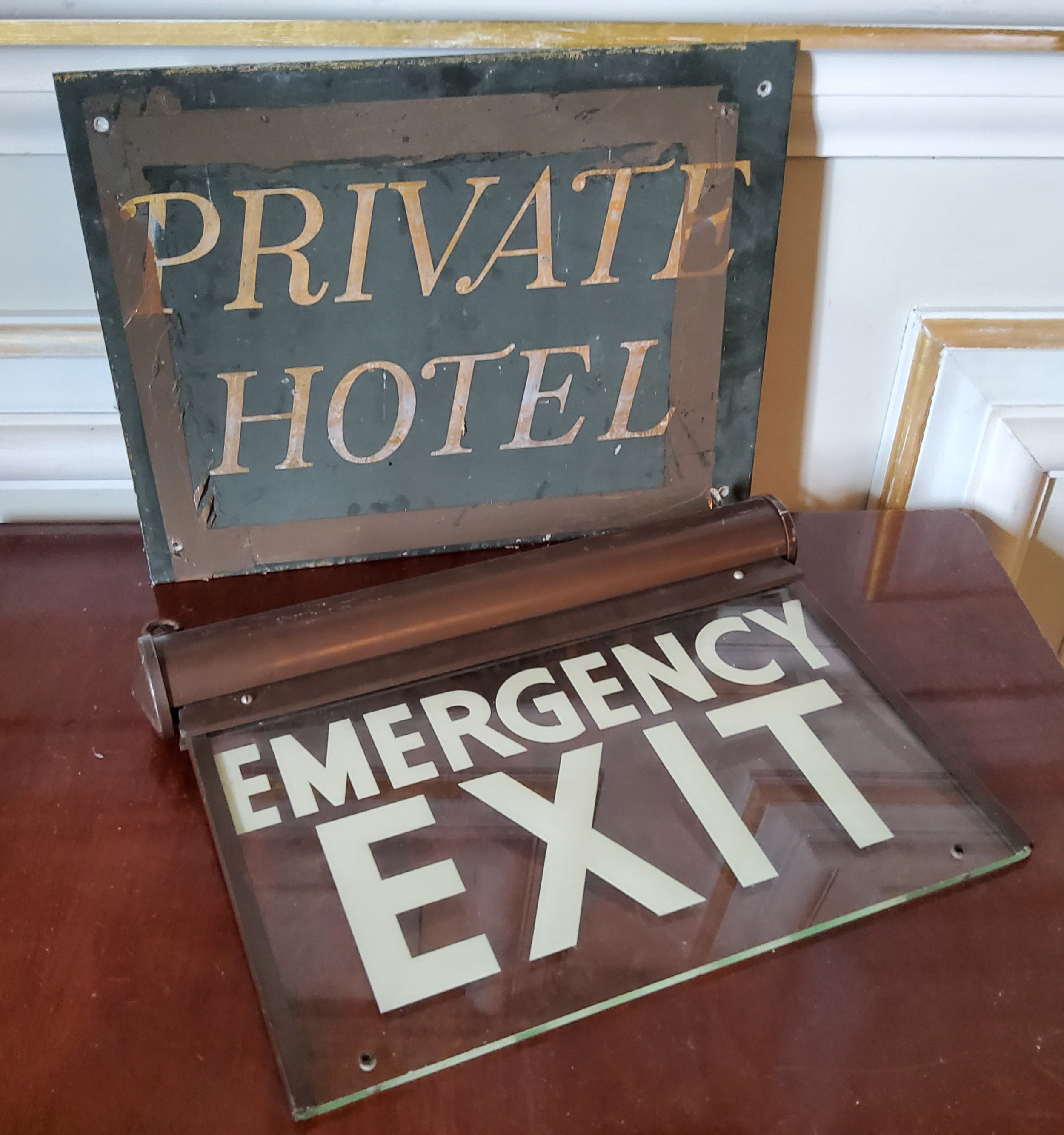 A 1950's/60's Linolite illuminated "Emergency Exit" sign (af); an original Hassop metal sign '