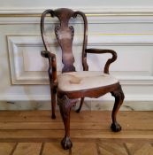 A George II design walnut shepherds crook open armchair raised on cabriole legs terminating with
