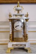 A large French Neo Classical Ormolu and gilt bronze mounted carrara marble mantel clock, with