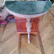 A 'limed oak' wall hanging console table, caryatid leg supporting a demi-lune green marble top 90