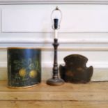 A black lacquered chinoiserie table lamp; a hand painted papier mache waste bucket (2)