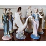 Decorative Ceramics - A NAO by Lladro model of a swan taking flight; six porcelain figures of