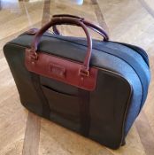 A genuine Mulberry suitcase on casters 55cm wide x 43cm high, tartan interior