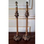 A pair of contemporary ornate metal and resin lamp bases in tones of gold & black 57cms high (PAT