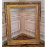 A substantial decorative gilt picture frame in the florentine style 158cm high x 127cm wide by 10 cm