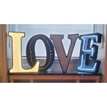 Interior Design - Large neon illuminating letters spelling 'LOVE' 65cm high x 10cm deep various