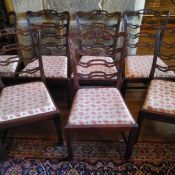 A set of ten Chippendale style mahogany function chairs with acorn and oak leaf upholstery (AF)
