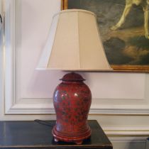 A large Chinese cinnabar lacquer table lamp in form of temple jar and cover, typical red ground