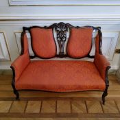 An Edwardian 'Hepplewhite' two seater salon sofa upholstered in rich terracotta and gold tones c.