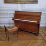 A Zimmerman upright piano, piano stool and music stand (used during wedding celebrations)
