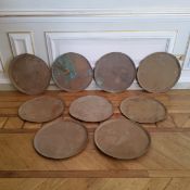 Nine large copper chargers, 58cm dia