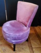 A contemporary bedroom/boudoir chair, upholstered in purple crushed velvet