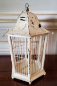 An 'Oriental' hanging birdcage in the form of a lantern 42cms high