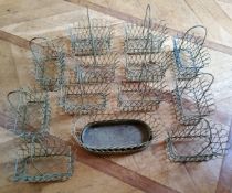 Twelve centrepiece wirework baskets, green; an oval wirework planter (13)