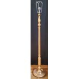 A Regency style gilded standard lamp, with a slender fluted column on a stepped and weighted base