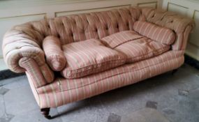 A Victorian deep button backed Chesterfield type country house sofa, traditional pink pin-striped