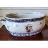 A 19th century French large blue & white two handled ceramic basin decorated with flowers and