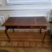 A Regency design mahogany sofa table with a quarter veneered surface, three drawers to frieze,