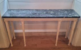 A French green marble topped console table, painted and distressed in tones of white, raised on 6