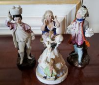 Three 19th century Pearlware figures of a Dandy, a Surprised Lady and a Fruit Carrier; another