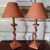 A pair of contemporary painted wood & rope table lamps in tones of terracotta & gold on stepped