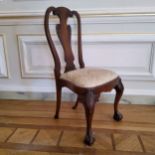A George II design walnut 'shepherds crook' hall chair, scalloped capped knees on cabriole fore legs