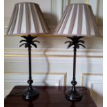 A pair of black/brown metal table lamps in the form of a palm tree, 51cms high excluding shades (PAT