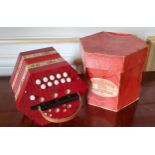 A German BM 20 key concertina, decorated with roses, leather strap original card box