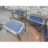 Three black papier-mâché style metal tray/table on foldable cross legs (af)