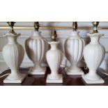 A pair of ceramic baluster shaped table lamps; a pair smaller pair and matching boudoir lamp (PAT