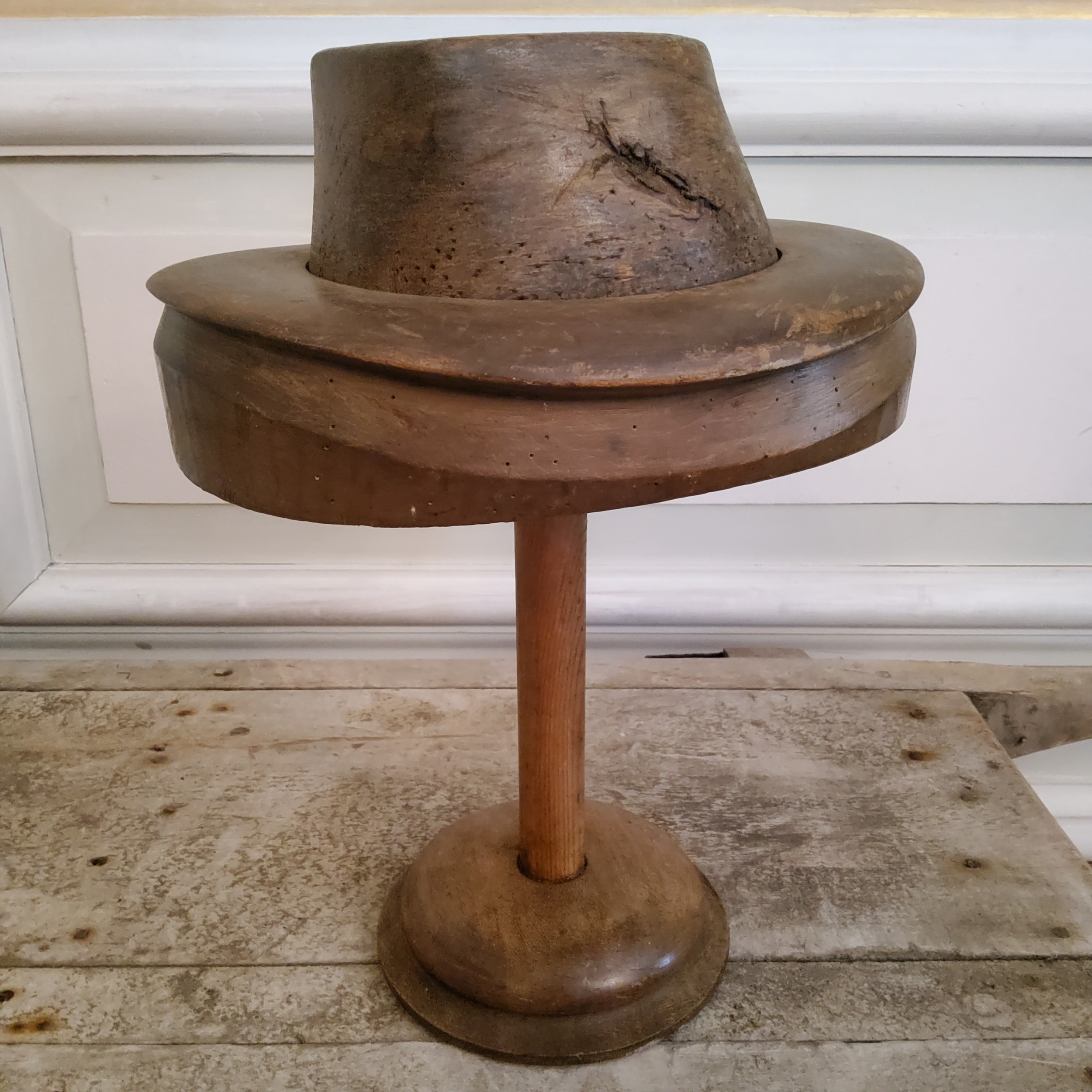 A 19th century French milliners fruit wood bowler hat block on stand