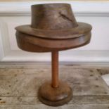 A 19th century French milliners fruit wood bowler hat block on stand