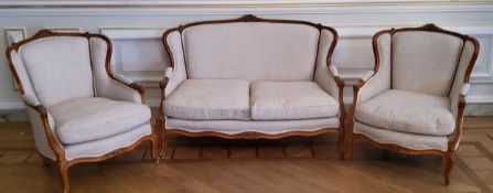 A recently upholstered early 20th century French three piece salon suite, French linen upholstery,