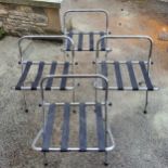 Four chrome collapsible luggage racks; another similar (5)