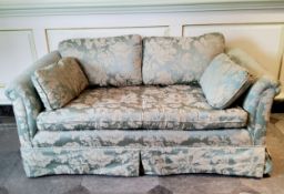 A small country house two seater 'loving seat' sofa with bold floral damask upholstery in tones of