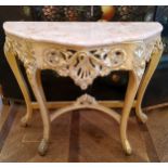 An ornate Louis XVI style 'Roccoco' marble topped gilt wood console, serpentine shaped pink marble