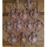 Twelve cartouche shaped room number plaques, resin cast as oak, (AF)